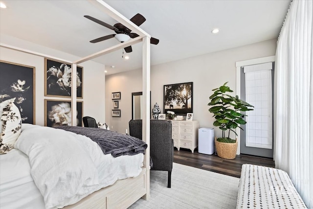 bedroom featuring ceiling fan and dark hardwood / wood-style flooring