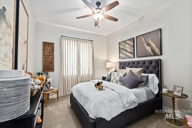 bedroom with ceiling fan and light colored carpet