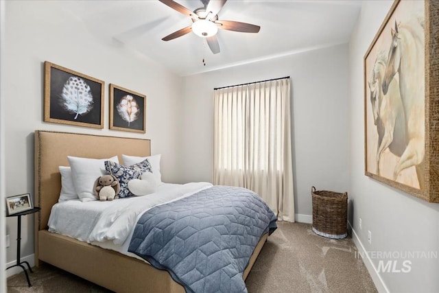 bedroom with ceiling fan and carpet