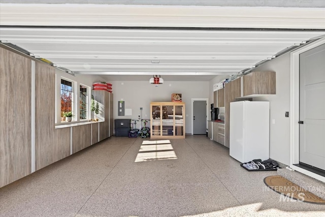 garage featuring white fridge