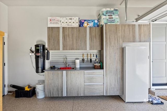 interior space featuring sink and white fridge