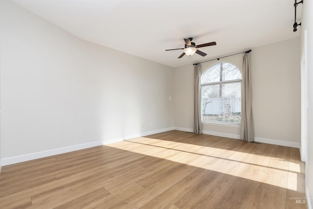 unfurnished room with ceiling fan and light wood-type flooring