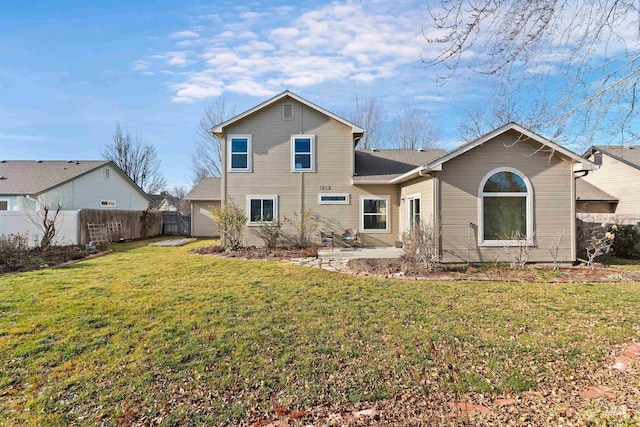 rear view of house with a lawn