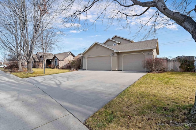 ranch-style home with a front lawn and a garage