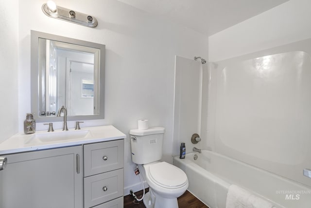 201 E 27th St, Burley, ID 83318 - full bathroom with toilet, shower / tub combination, vanity, and wood finished floors