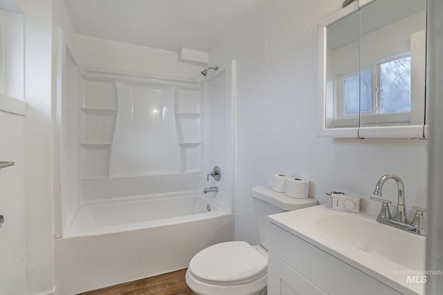 201 E 27th St, Burley, ID 83318 - full bathroom with toilet, wood finished floors, vanity, and shower / washtub combination