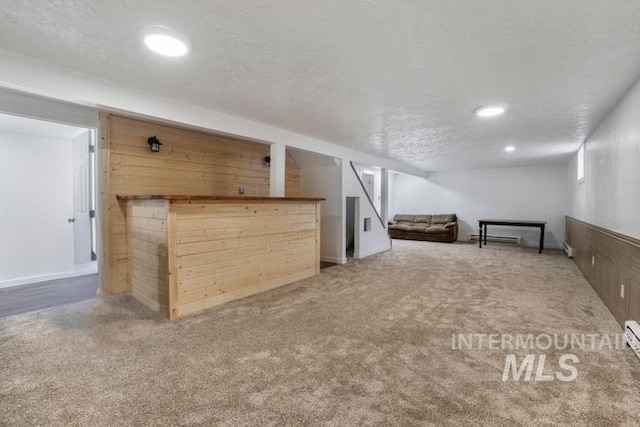 201 E 27th St, Burley, ID 83318 - finished basement with recessed lighting, carpet, baseboard heating, and a textured ceiling