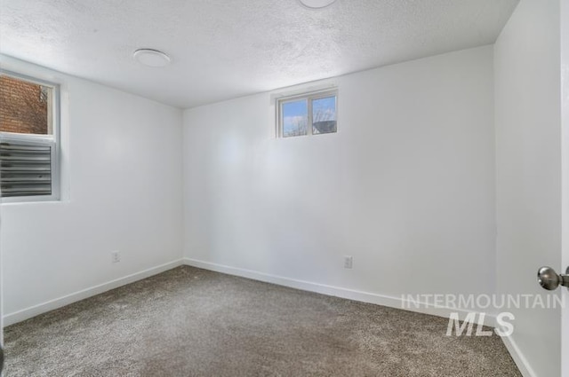 201 E 27th St, Burley, ID 83318 - spare room with a textured ceiling, baseboards, and carpet