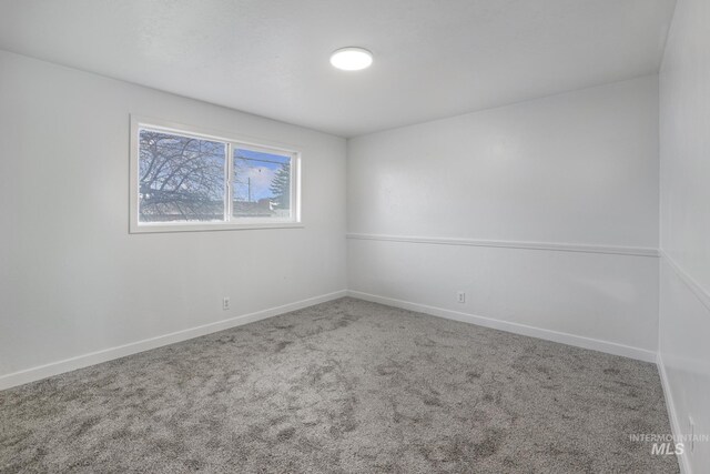 201 E 27th St, Burley, ID 83318 - empty room with baseboards and carpet