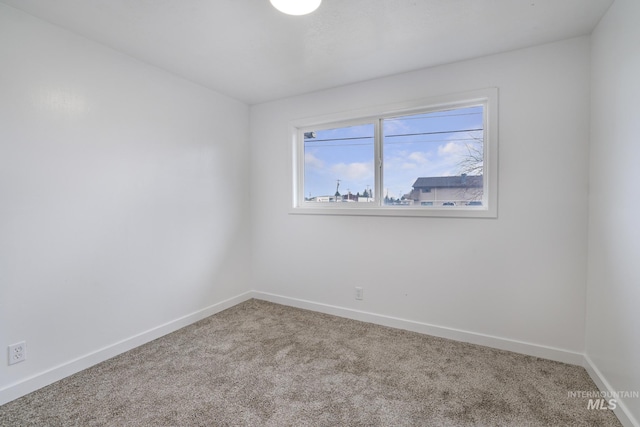 201 E 27th St, Burley, ID 83318 - carpeted empty room featuring baseboards