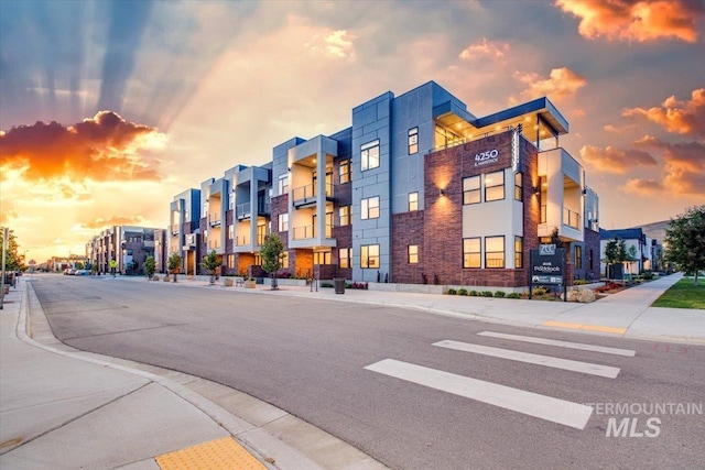 view of outdoor building at dusk