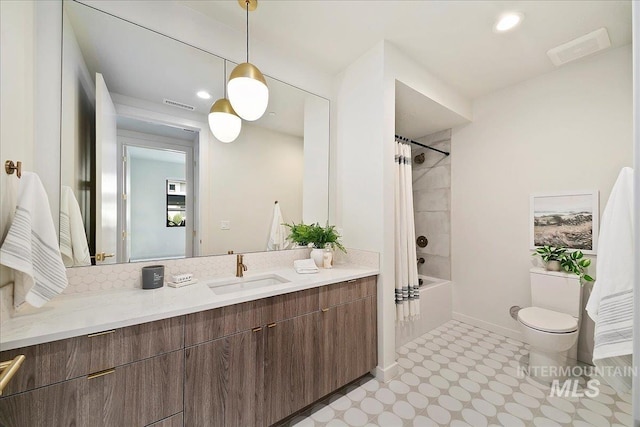 full bathroom featuring shower / tub combo, vanity, and toilet