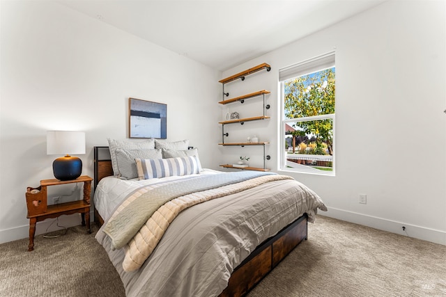 bedroom with carpet flooring and baseboards