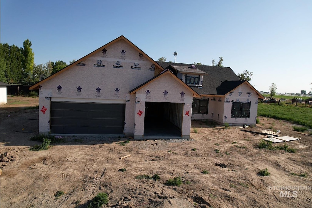 771 Biscotti Loop, Heyburn, ID 83336 - property in mid-construction with dirt driveway, an attached garage, and stucco siding