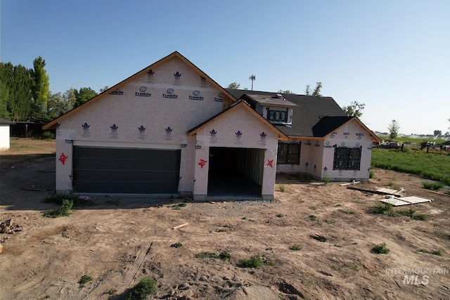 771 Biscotti Loop, Heyburn, ID 83336 - property in mid-construction with dirt driveway, an attached garage, and stucco siding