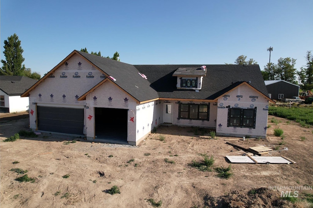 771 Biscotti Loop, Heyburn, ID 83336 - unfinished property featuring a garage and dirt driveway