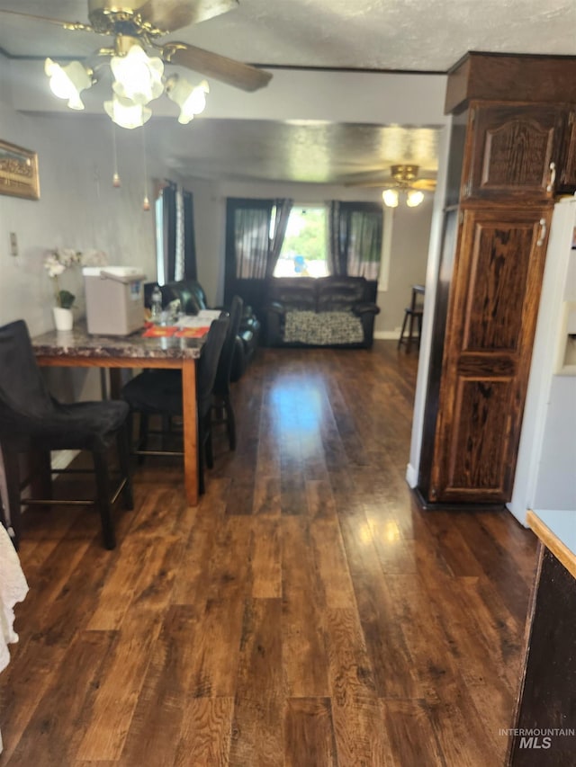 846 Wyoming St, Gooding, ID 83330 - dining room with ceiling fan and dark wood-style flooring