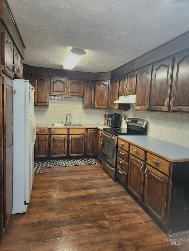 846 Wyoming St, Gooding, ID 83330 - kitchen with a sink, freestanding refrigerator, stainless steel electric range, under cabinet range hood, and dark wood-type flooring