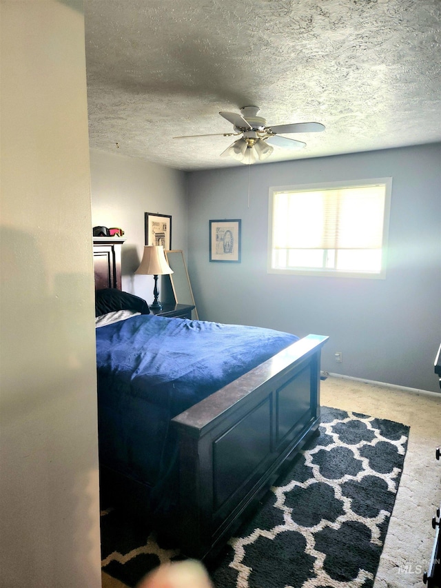 846 Wyoming St, Gooding, ID 83330 - bedroom with baseboards, ceiling fan, carpet, and a textured ceiling