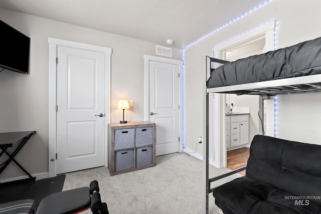 7531 E Lafayette St, Nampa, ID 83687 - bedroom with light colored carpet, ensuite bath, and baseboards