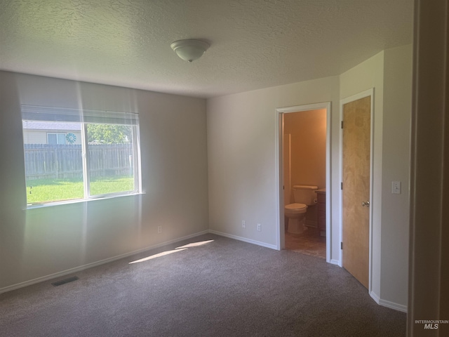 2451 W Park Stone Dr, Meridian, ID 83646 - carpeted spare room with a textured ceiling and baseboards