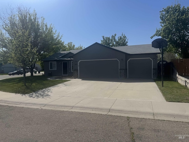 2451 W Park Stone Dr, Meridian, ID 83646 - ranch-style home with an attached garage and concrete driveway