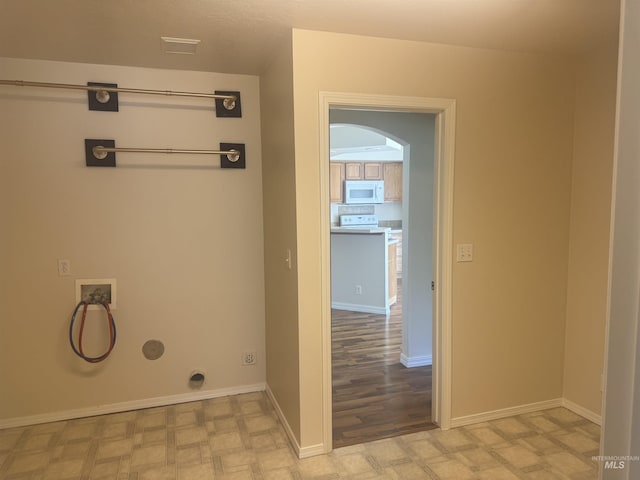 2451 W Park Stone Dr, Meridian, ID 83646 - laundry area with washer hookup, arched walkways, light flooring, and baseboards