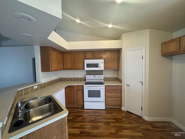 2451 W Park Stone Dr, Meridian, ID 83646 - kitchen with white appliances, a sink, brown cabinetry, dark wood-type flooring, and light countertops