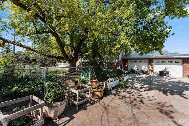20035 Franklin Rd, Nampa, ID 83687 - view of patio with a garden and a detached garage