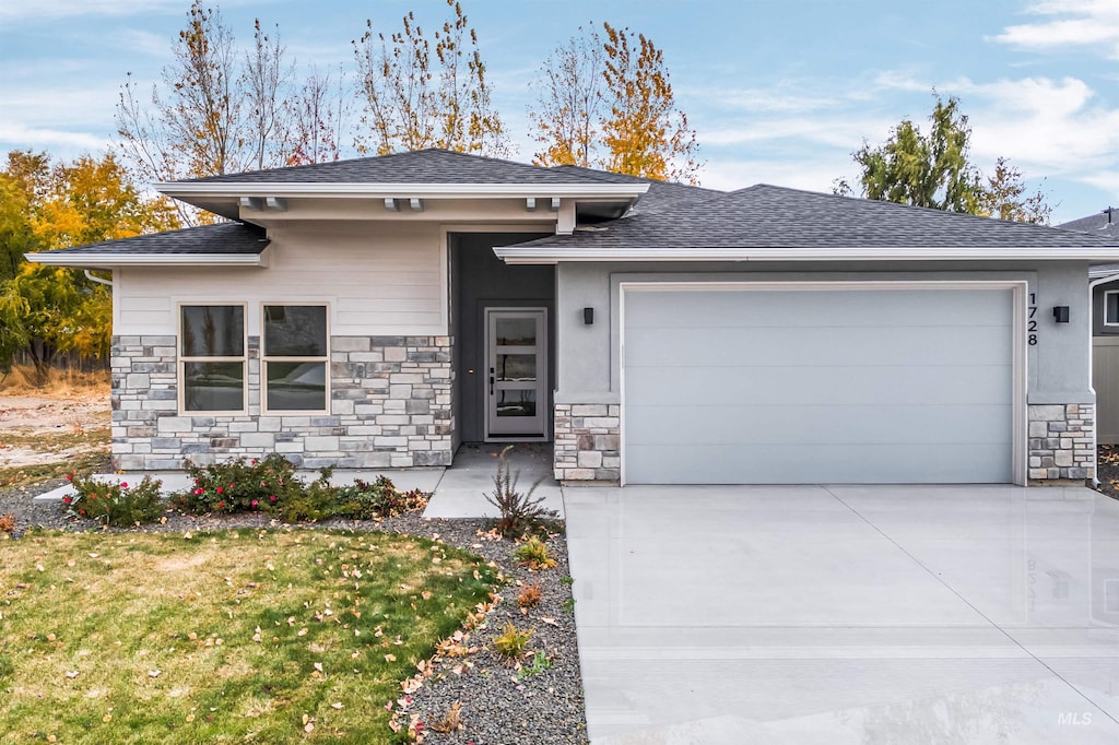 prairie-style house featuring a garage