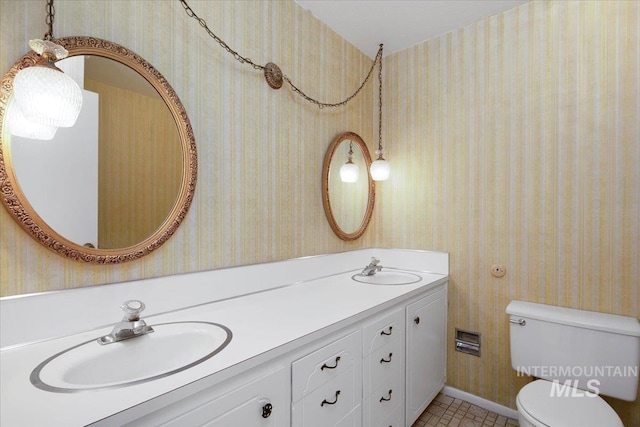 bathroom featuring vanity and toilet