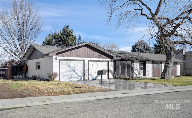 view of front of home with a garage and a front yard