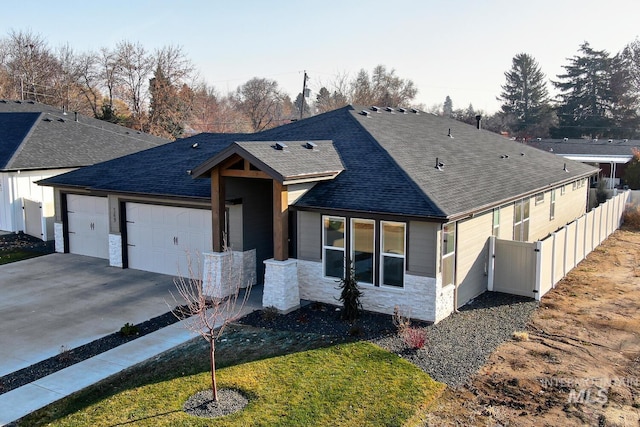 view of front of house with a garage and a front lawn