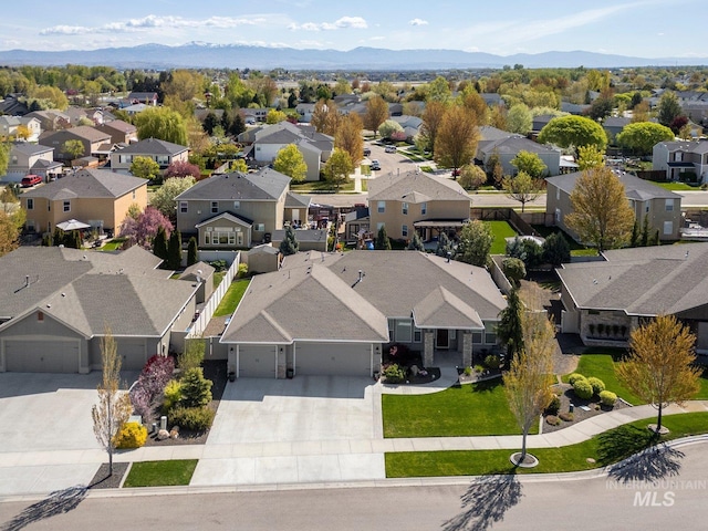 aerial view with a mountain view and a residential view