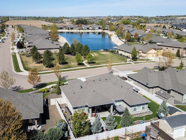 bird's eye view with a residential view and a water view