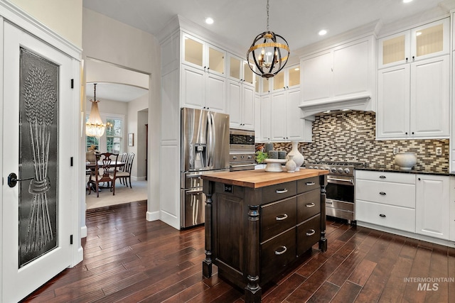 724 E Lakebrook Ln, Eagle, ID 83616 - kitchen with a chandelier, appliances with stainless steel finishes, wood counters, white cabinetry, and recessed lighting