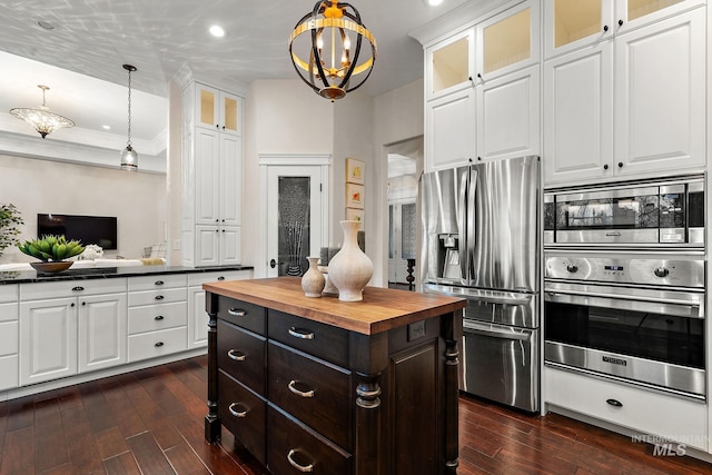 724 E Lakebrook Ln, Eagle, ID 83616 - kitchen featuring stainless steel appliances, butcher block counters, white cabinetry, dark wood-type flooring, and ornamental molding