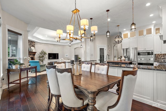 724 E Lakebrook Ln, Eagle, ID 83616 - dining room with a chandelier, recessed lighting, dark wood-style flooring, and a raised ceiling