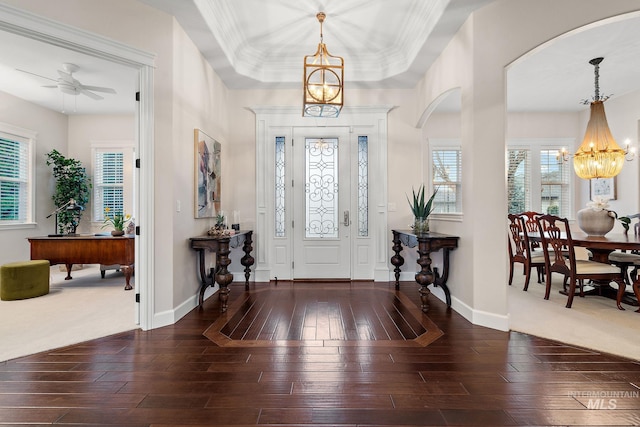724 E Lakebrook Ln, Eagle, ID 83616 - entrance foyer featuring a chandelier, wood-type flooring, arched walkways, and healthy amount of natural light