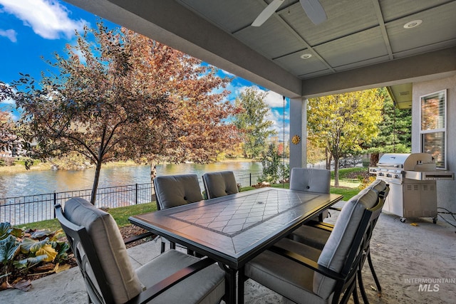 724 E Lakebrook Ln, Eagle, ID 83616 - view of patio / terrace with a water view, outdoor dining area, ceiling fan, and area for grilling