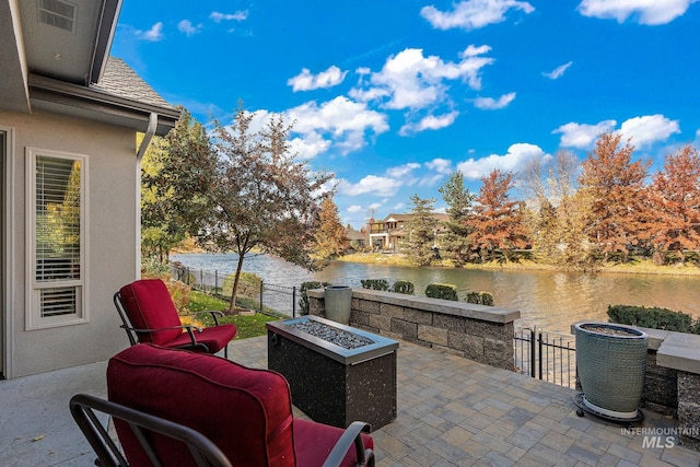 724 E Lakebrook Ln, Eagle, ID 83616 - view of patio with a water view and a fire pit