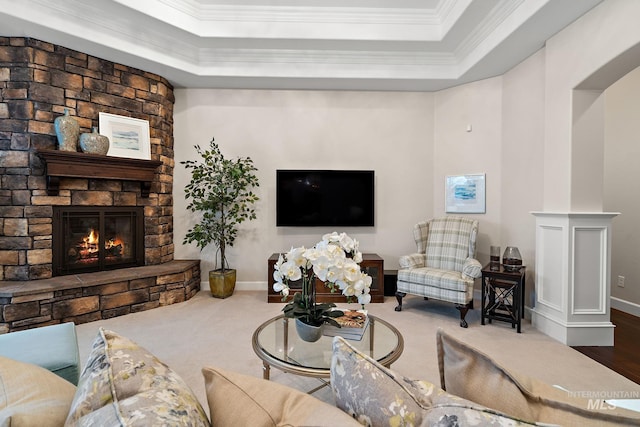724 E Lakebrook Ln, Eagle, ID 83616 - carpeted living room with a stone fireplace, crown molding, and a tray ceiling
