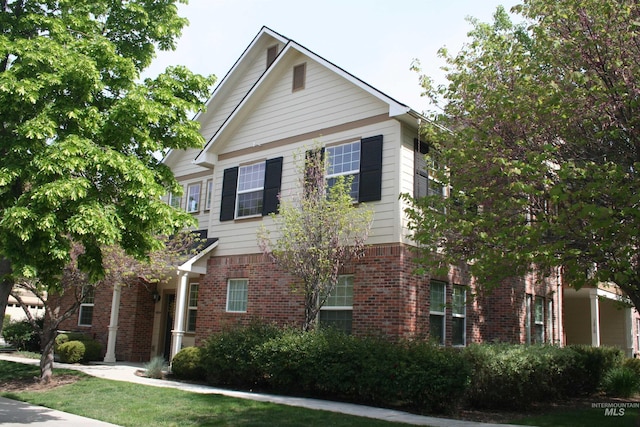 view of front of property with brick siding