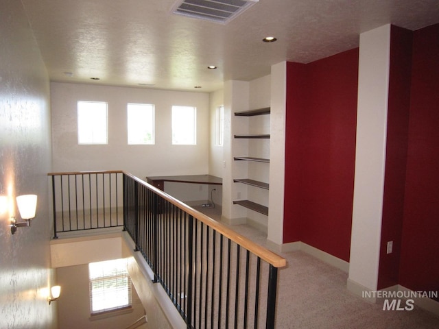 staircase with carpet floors, built in shelves, recessed lighting, and baseboards