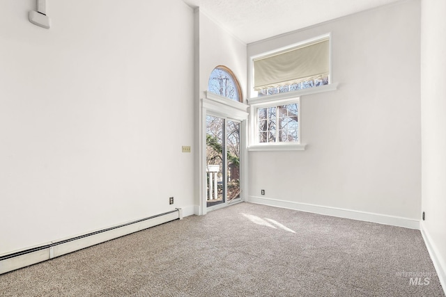 unfurnished room featuring carpet floors, a baseboard radiator, and baseboards