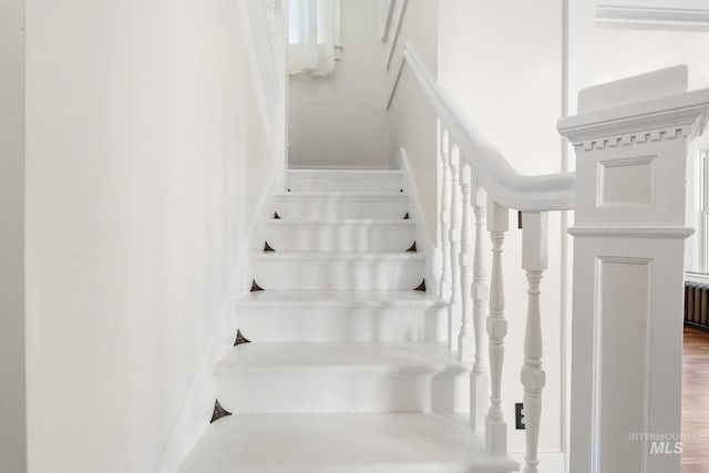 stairway featuring radiator