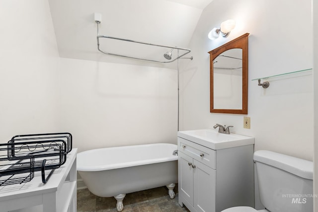 full bath featuring a freestanding bath, vanity, and toilet