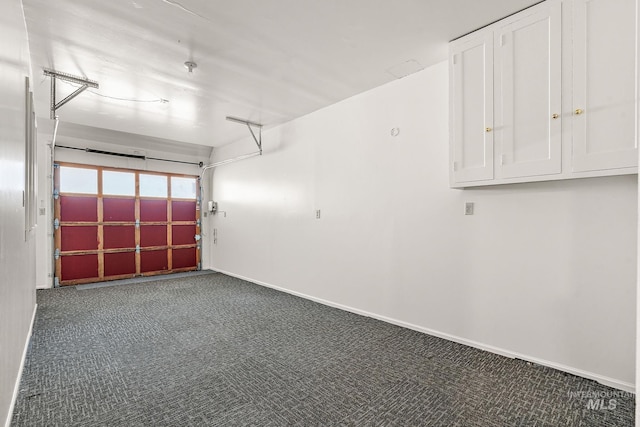 garage featuring baseboards