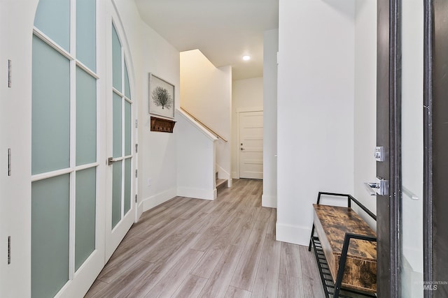 entryway with light hardwood / wood-style flooring