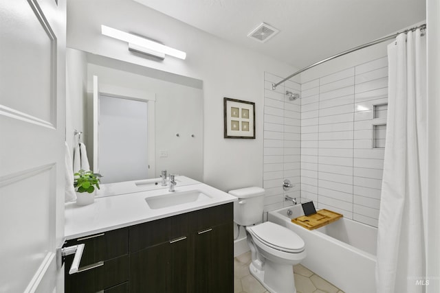 full bathroom featuring toilet, vanity, tile patterned flooring, and shower / tub combo with curtain